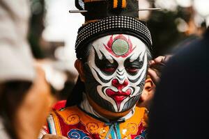 Ho Chi Minh City, Vietnam - August 19, 2023 Artists performing Vietnamese classical opera make up for the show in Binh Thanh District photo