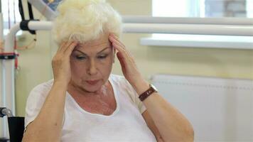 Female patient massages her head video