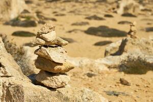 Stones stacked on top of each other with a blurred background. photo