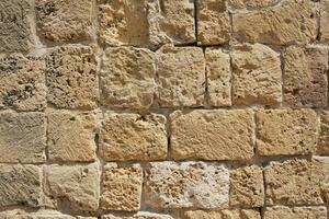 The wall is made of stones as a decorative background. photo