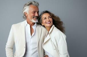 older couple smiling and laughing at each other photo