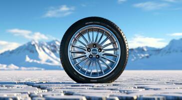 a car tire on cold snowy roads with snow falling down photo