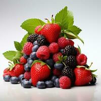a mound of strawberries, raspberries, blueberries and mint, isolated photo