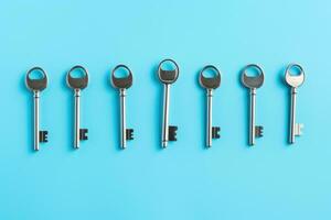bunch of keys , isolated on blue . AI Generated photo