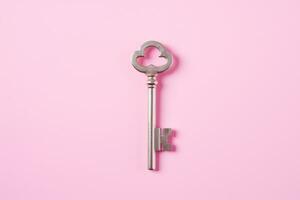 a key, isolated on pink background. AI Generated photo