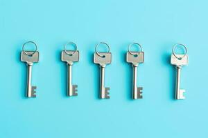 bunch of keys , isolated on blue . AI Generated photo