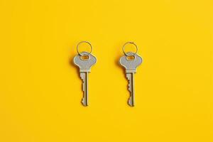 a key, isolated on yellow background. AI Generated photo