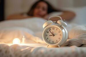 white alarm clock on bedside table in bedroom, woman sleeping on bed in background. AI Generated photo