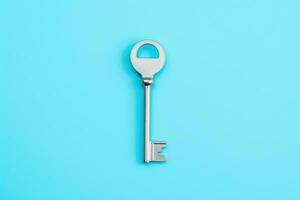 a key, isolated on blue background. AI Generated photo