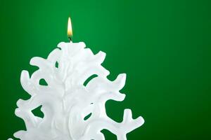 Christmas candle shaped like a Christmas tree photo