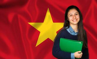 Teen student smiling over Vietnamese flag photo