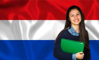 Teen student smiling over Dutch flag photo