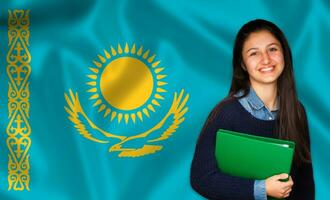 Teen student smiling over Kazakh flag photo