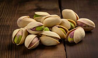 Table scattered with pistachios in a close-up shot Creating using generative AI tools photo