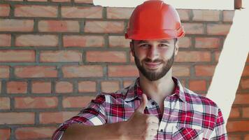 Male builder shows his thumb up video