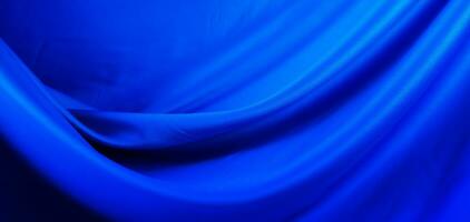 blue shiny flowing silk background photo