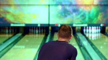 Man rolls the bowling ball video