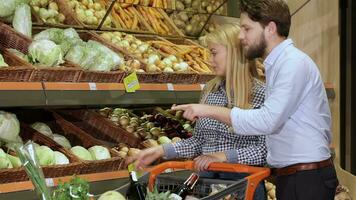 Couple buy cabbage at the mall video