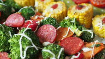 smoked salami sausage, corn and Broccoli in a bowl video