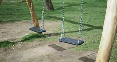 Closeup of a baby swing in the playground video