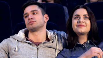 Couple watches movie at the cinema video