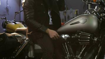 Male biker looks into the mirror of motorcycle video