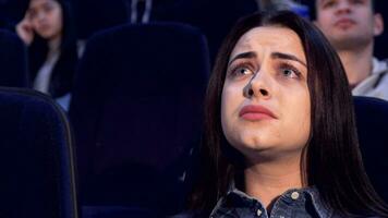 Woman watches drama at the movie theater video