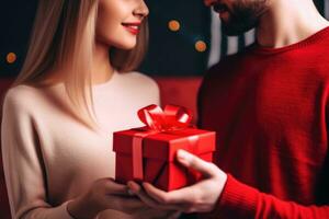 Close up shot of female hands holding a small gift wrapped with red ribbon. AI Generated photo