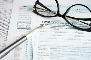 Tax form 1040 U.S. Individual Income Tax Return, business finance concept. photo