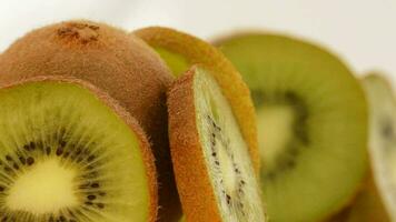 Kiwi fruit slices rotating. Loop video