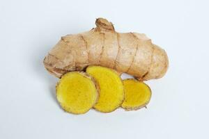 kunyit putih temu putih rimpsng white turmeric fresh curcuma zedoaria root top view with white background photo