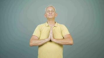 Man meditating looking at camera. video