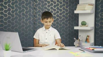 The boy is very happy to read books. video