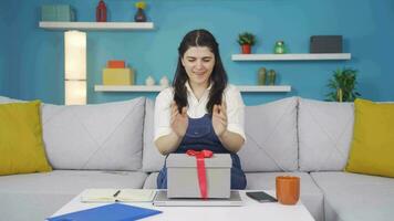 Happy and joyful woman opening gift package. video