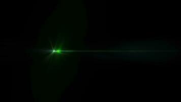 Burst glow green star light optical lens flares shine art animation movint from left to right side on black abstract background video