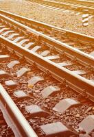 Photo fragment of the railroad tracks in the rainy weather