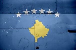 Kosovo flag depicted on side part of military armored helicopter closeup. Army forces aircraft conceptual background photo