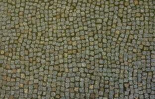 Photo of a platform made of paving stones of a square shape. Top view