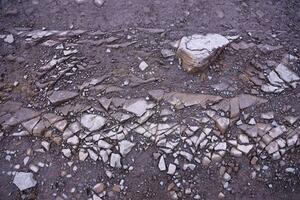 Background of shattered stony stones surface in mountain area. Texture with natural light photo