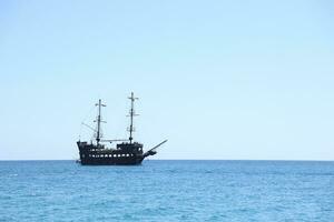 ANTALYA, TURKEY - MAY 15, 2021 Excursion Kemer pirate Boat Tour Monster on the Turkish Mediterranean. photo