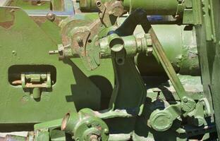 A close-up mechanism of a portable weapon of the Soviet Union of World War II, painted in a dark green color photo