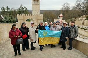 TERNOPIL, UKRAINE - APRIL 2, 2023 People with flag during mission in complex of Ukrainian Jerusalem in the Mari spiritual center of Zarvanytsia In the Terebovlya district of the Ternopil photo