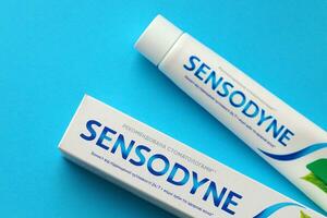 KYIV, UKRAINE - MAY 4, 2022 Sensodyne fluorine or fluor is a daily fluoride toothpaste photo