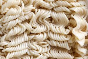 Instant cooking noodles macro texture in boiled condition photo