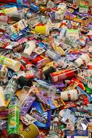 KHARKOV, UKRAINE - AUGUST 10, 2021 Big pile of various wrappings and empty disposable packages and cups from famous branded food production photo
