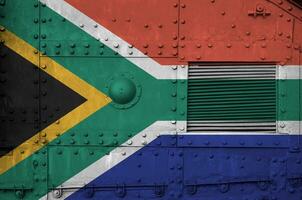 South Africa flag depicted on side part of military armored tank closeup. Army forces conceptual background photo