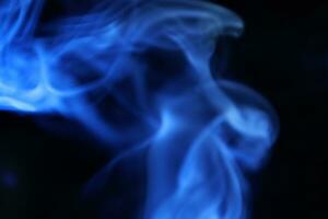 Blue smoke on a dark background, blue wave photo