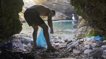 Nature lover man who collects garbage thrown into nature. video