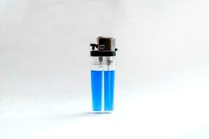 Blue plastic lighter on white background photo