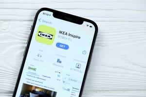 KHARKOV, UKRAINE - MARCH 5, 2021 Ikea icon and application from App store on iPhone 12 pro display screen on white table photo